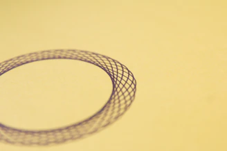 Pattern of delicate, overlapping circles in muted mocha and sand tones, creating a serene backdrop.