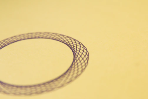 Pattern of delicate, overlapping circles in muted mocha and sand tones, creating a serene backdrop.