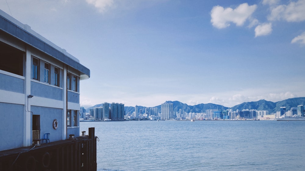 white and brown concrete building near body of water during daytime