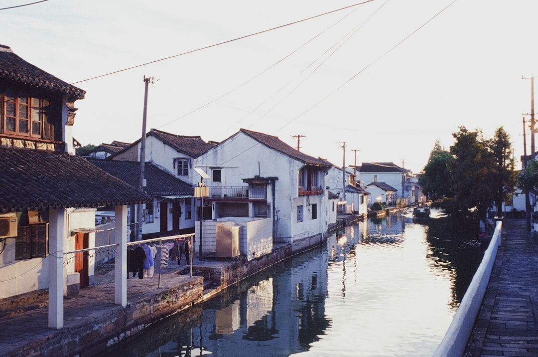 houses near body of water during daytime