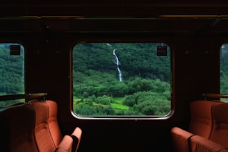 person holding black smartphone with brown leather case
