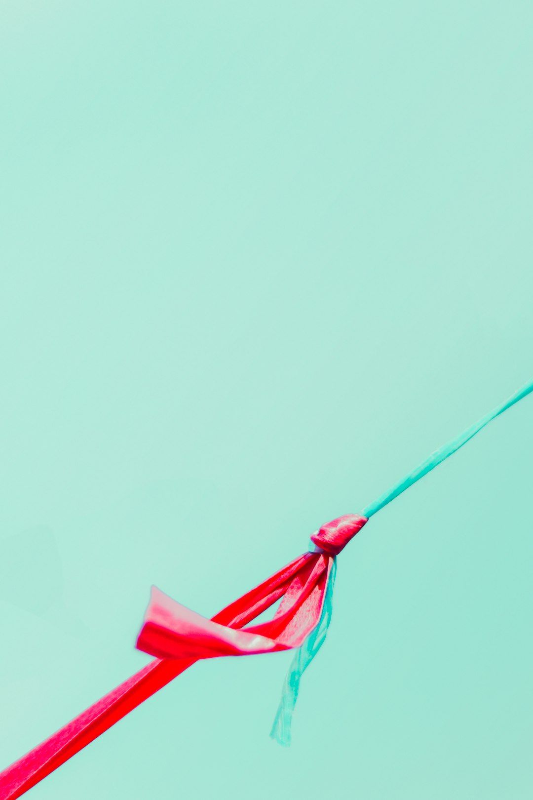  red umbrella with green rope string