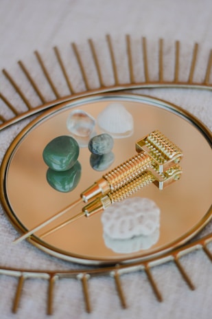 A detailed shot of integrative medicine tools gently arranged on a wooden table with soft blue and brown tones.