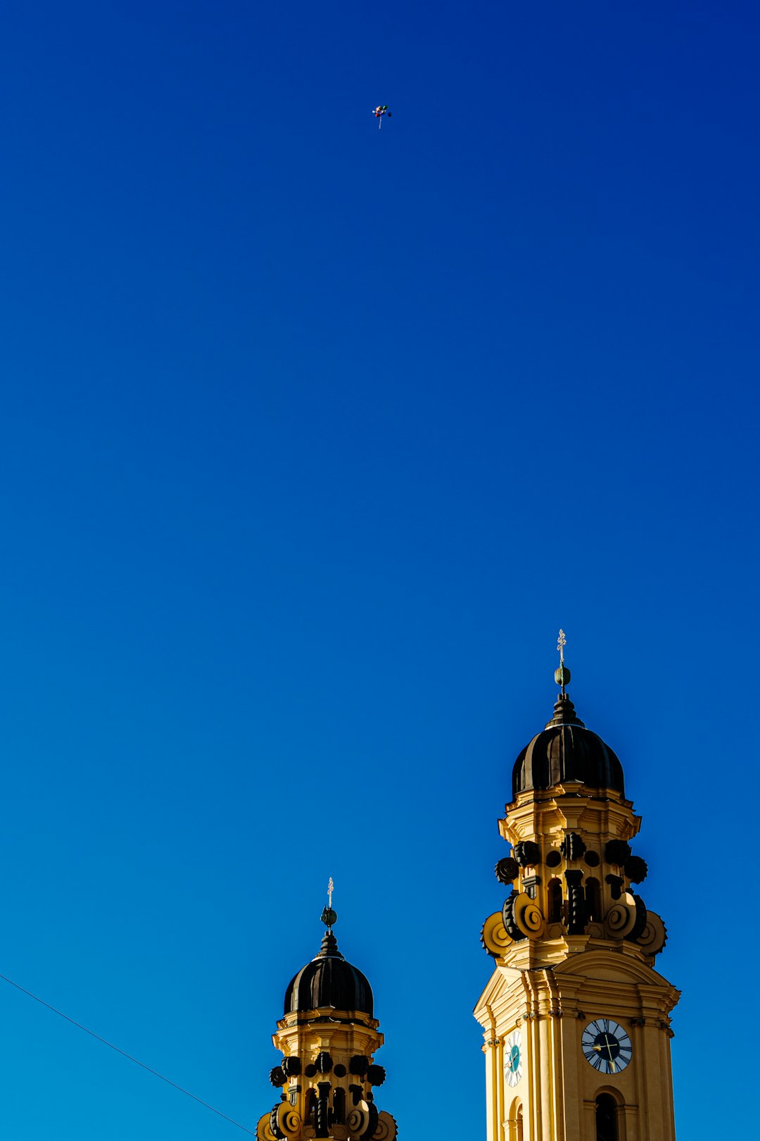 gold and white tower under blue sky during daytime