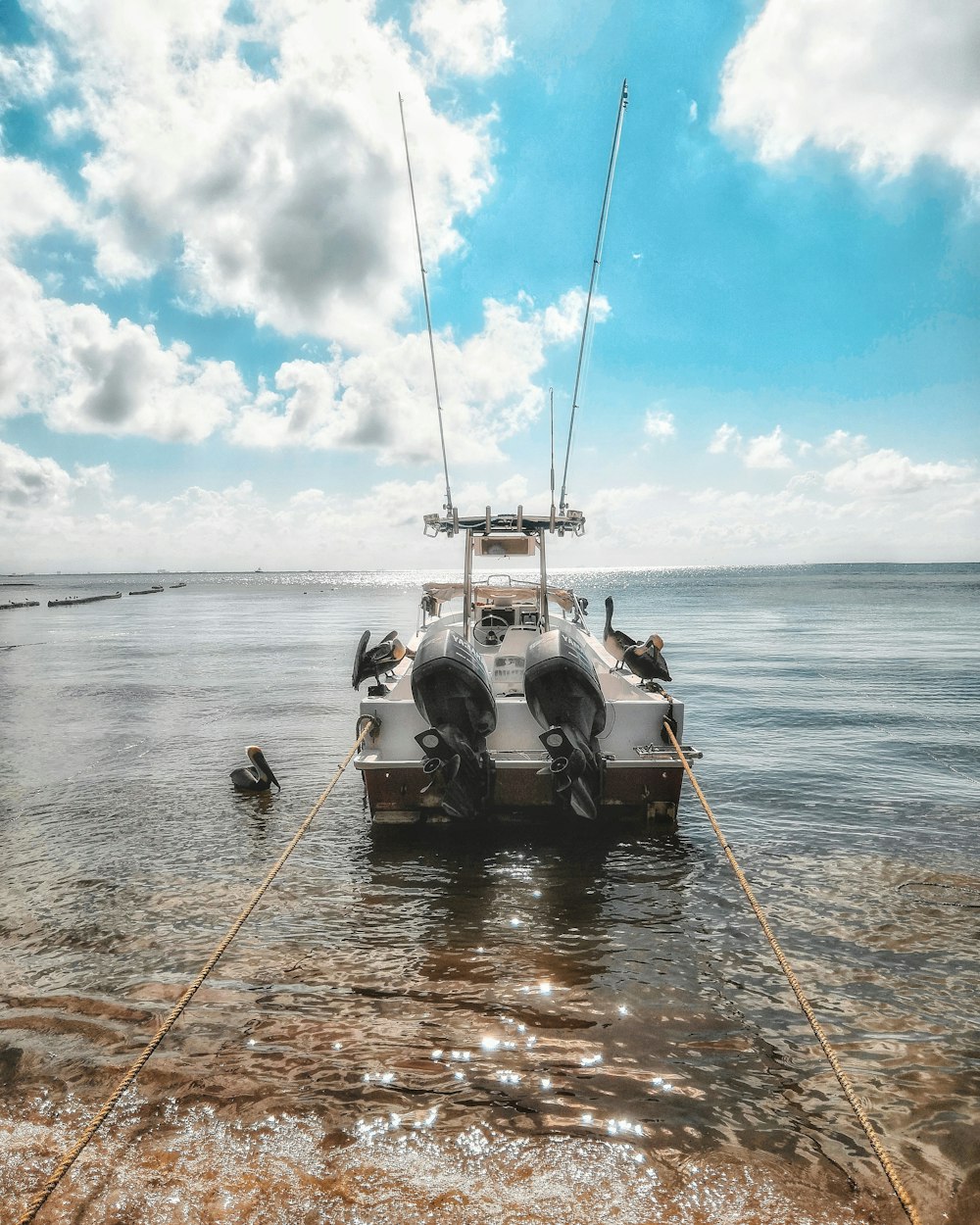 3 men riding on boat during daytime