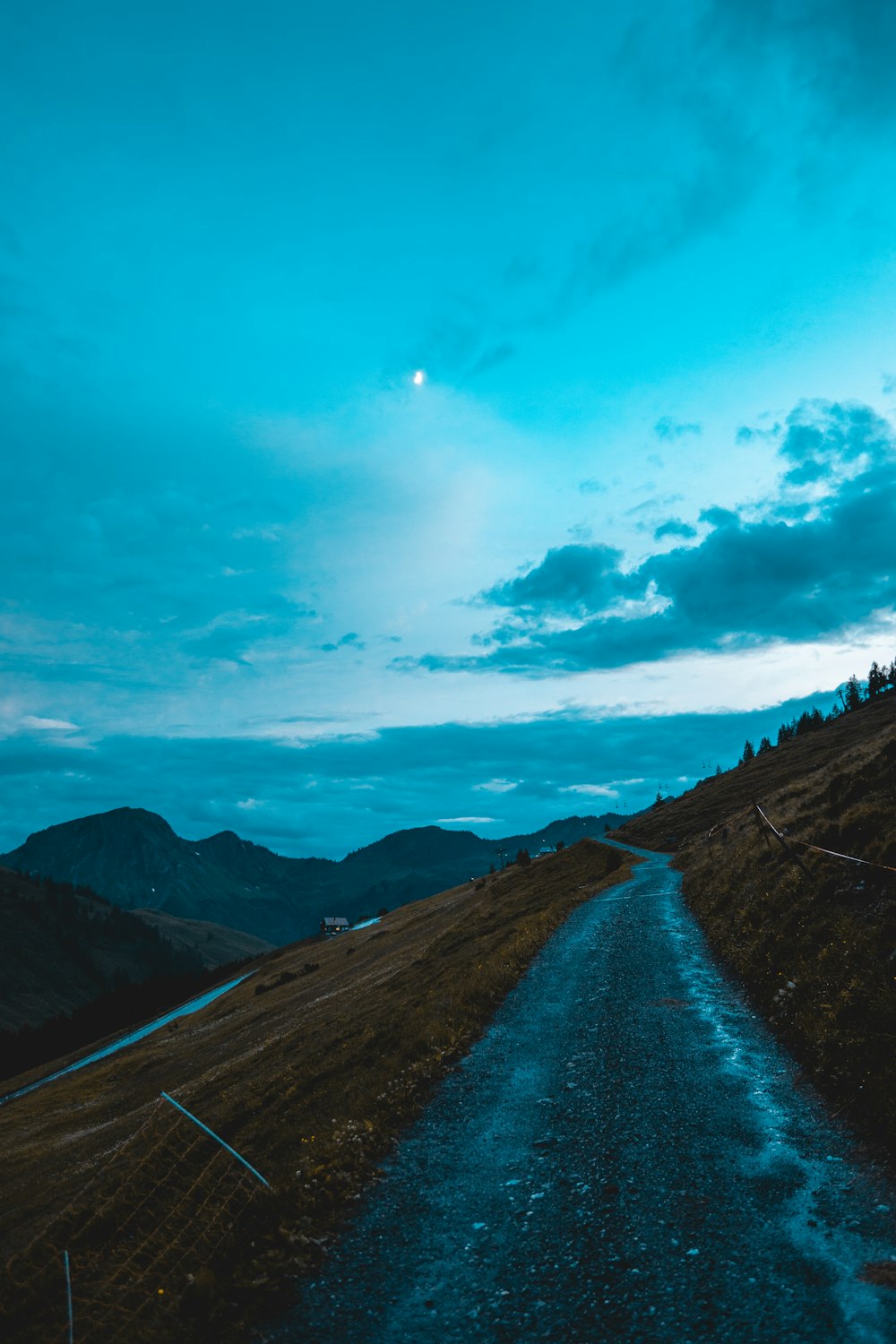 blue sky and white clouds over the mountains