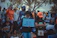 A joyful group of diverse church members united in prayer outdoors.