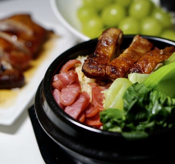 cooked food on black ceramic bowl