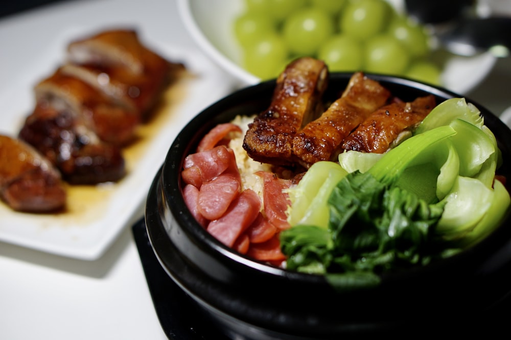 cooked food on black ceramic bowl