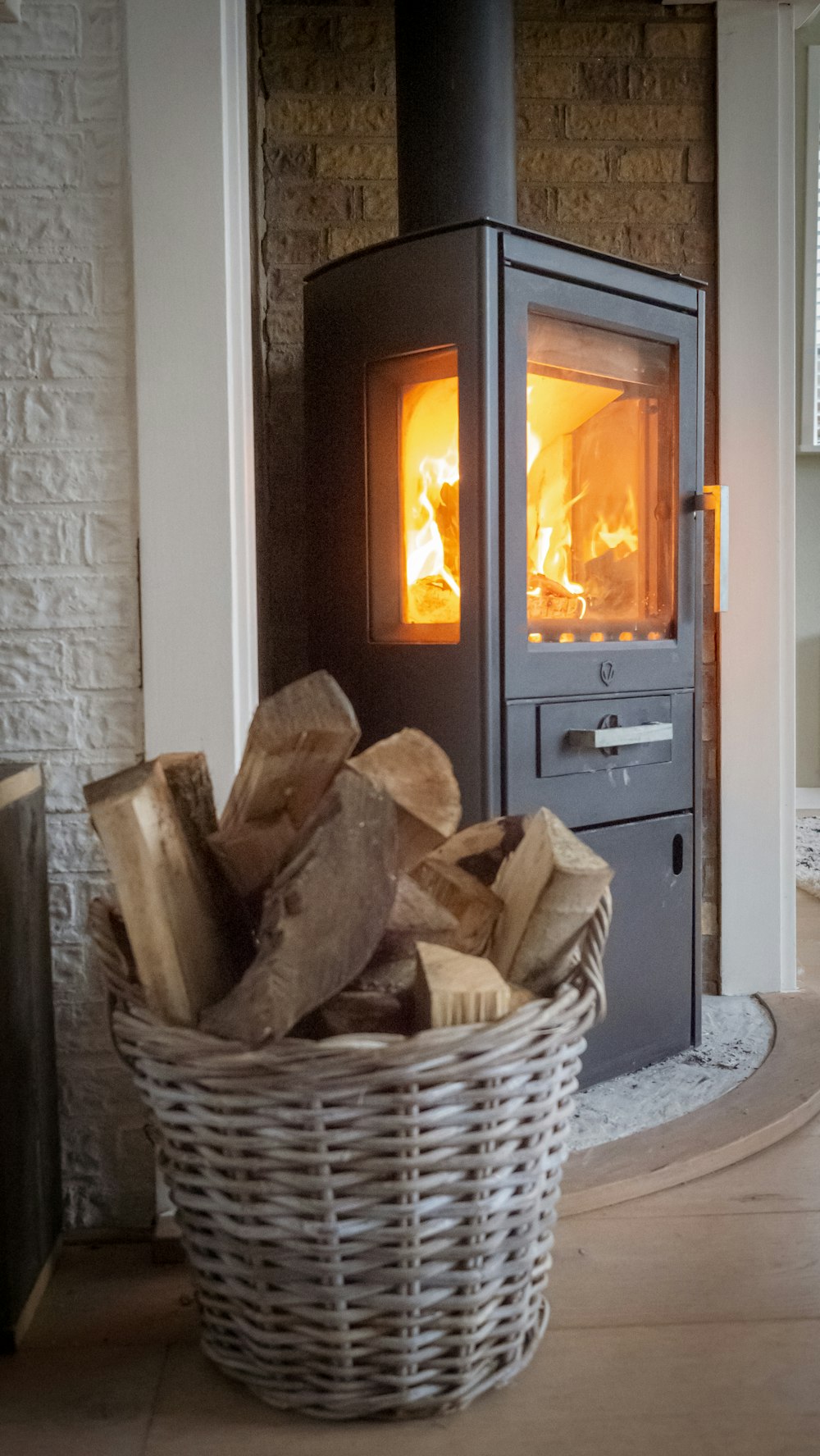 brown wooden fire place in front of white wooden door