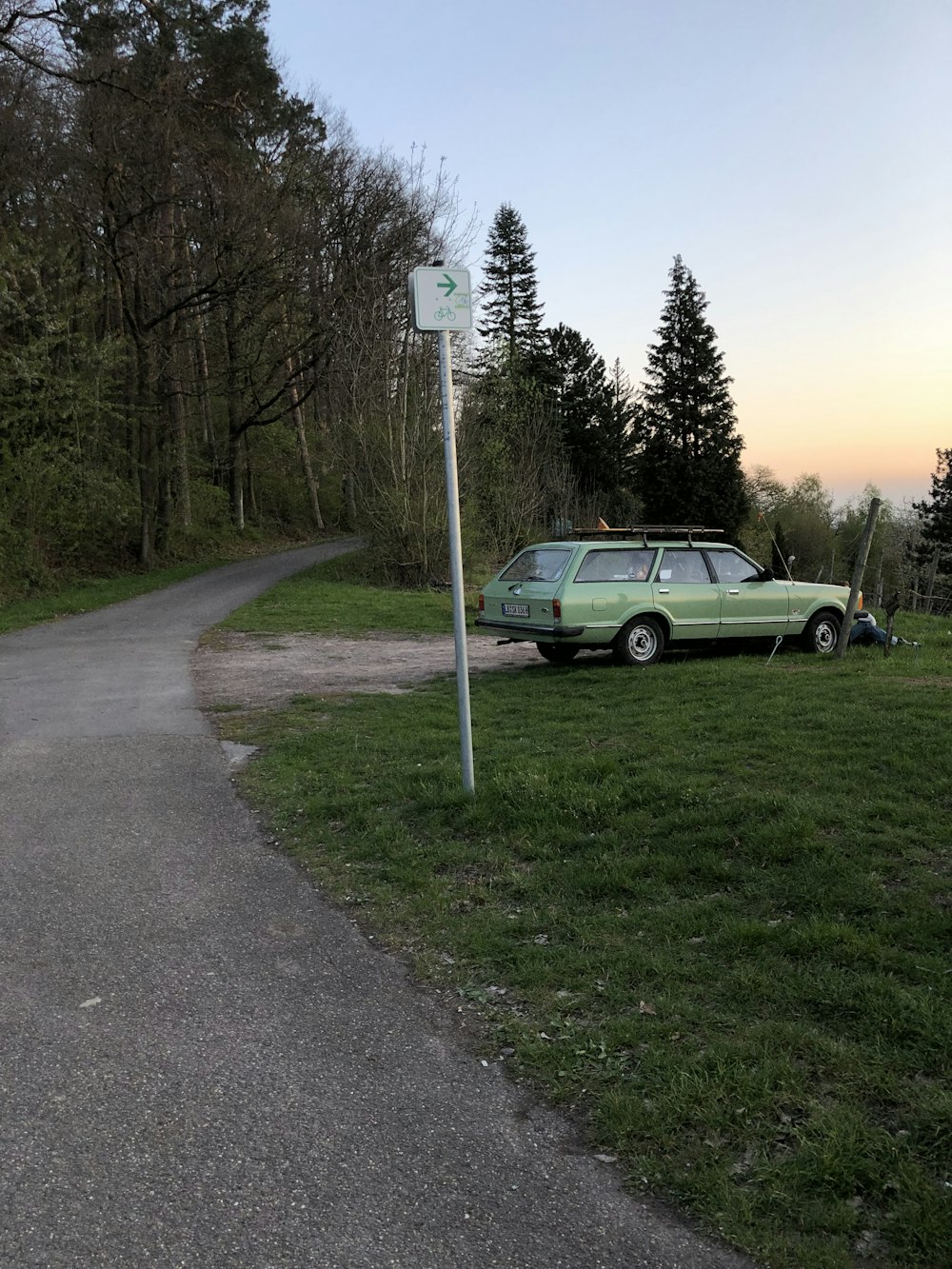 black suv on gray asphalt road during sunset