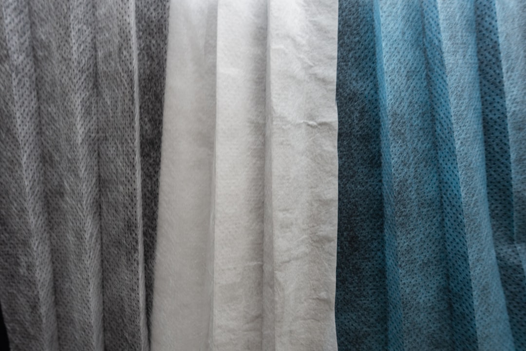white textile on blue towel