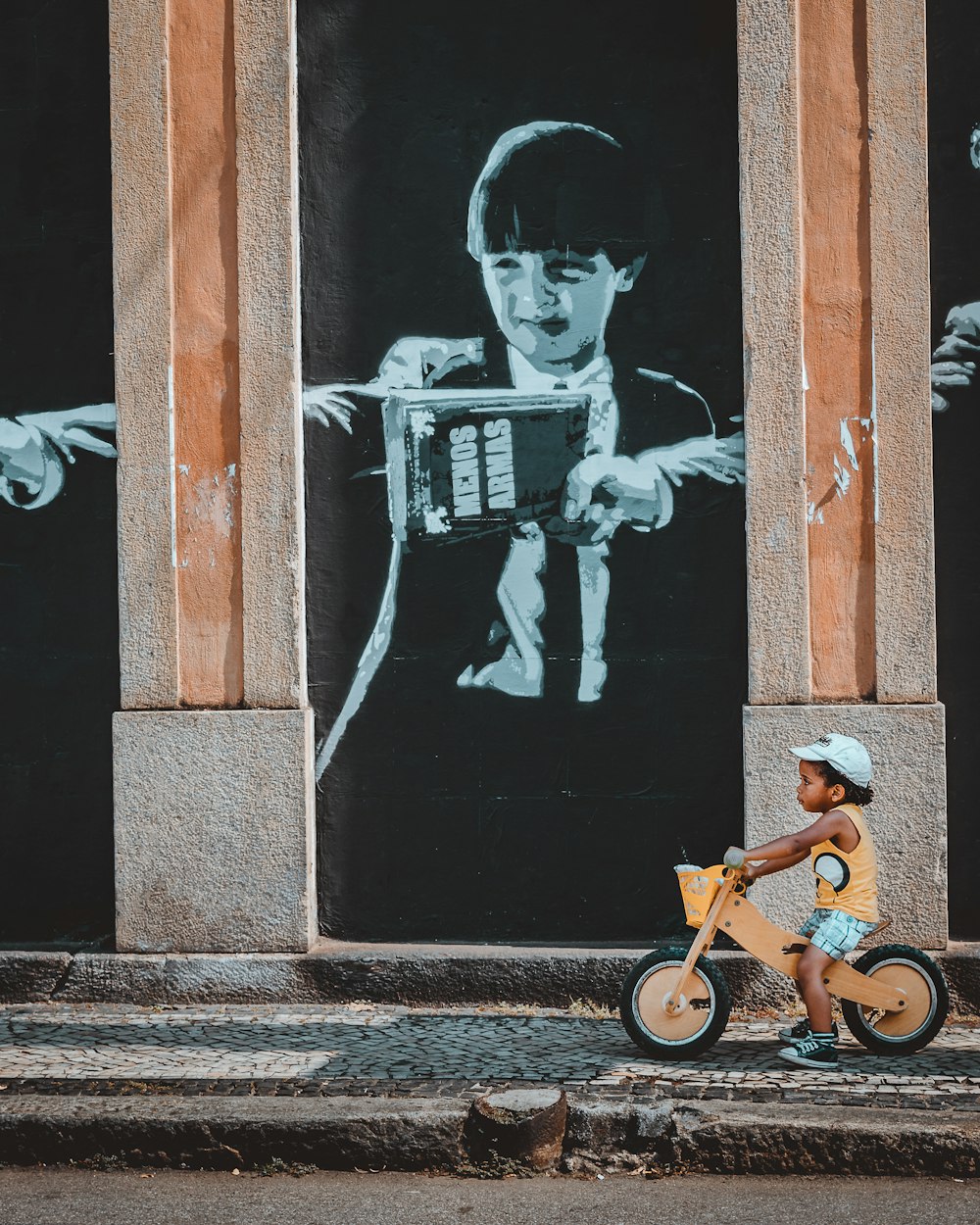 man riding bicycle with woman in black dress painting