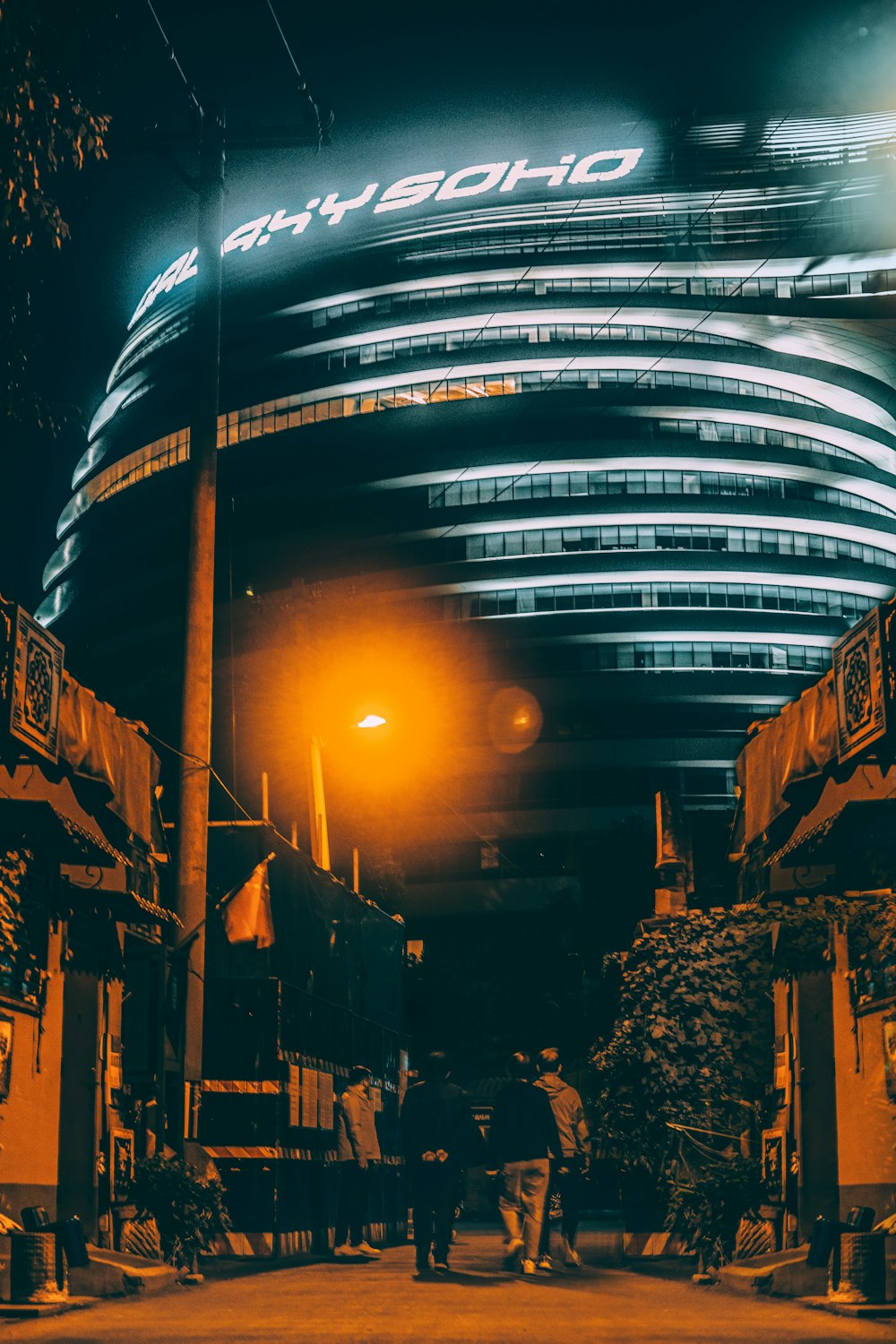 people walking on street during night time