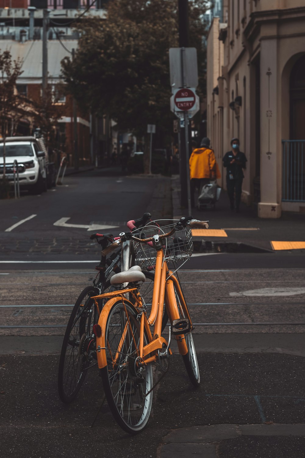 black and yellow bicycles on road during daytime