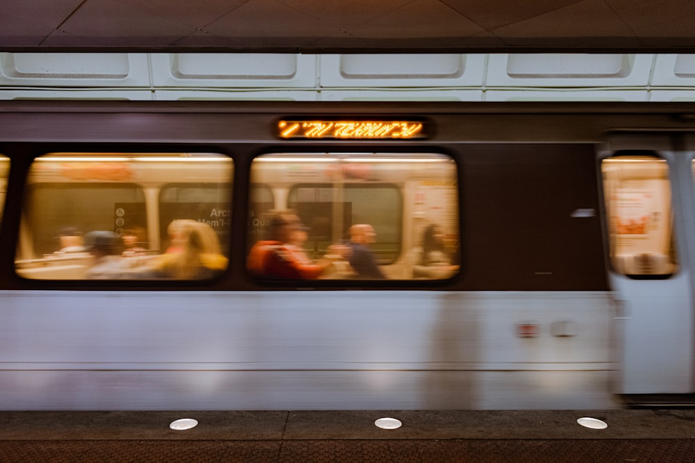 white and gray train on train station