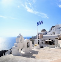 white concrete building near body of water during daytime