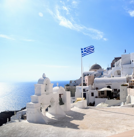 white concrete building near body of water during daytime