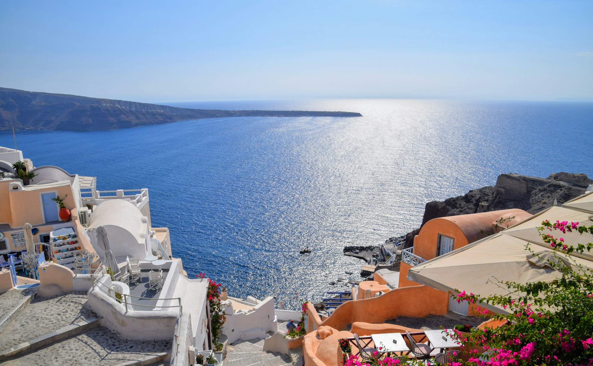 white and brown houses near sea during daytime