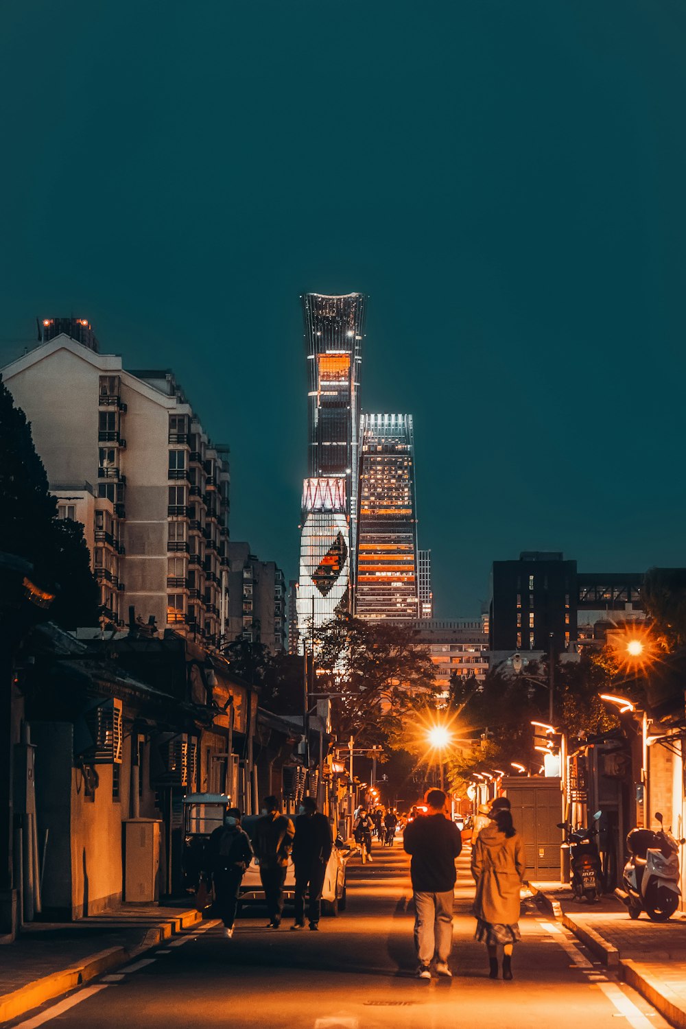 people walking on street during night time