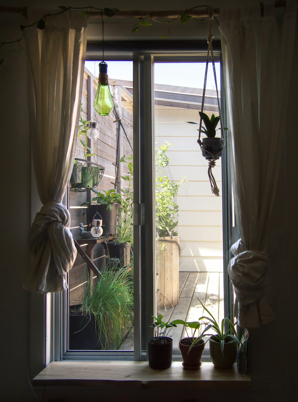 white window curtain near white framed glass window