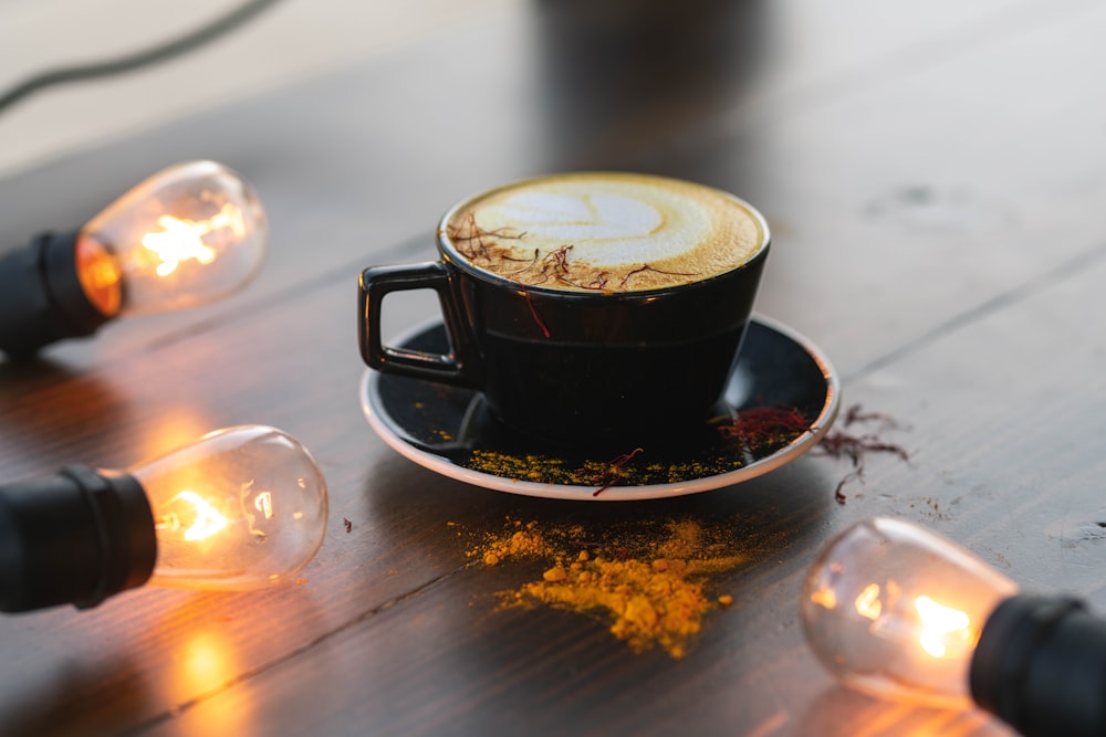 black ceramic cup on saucer