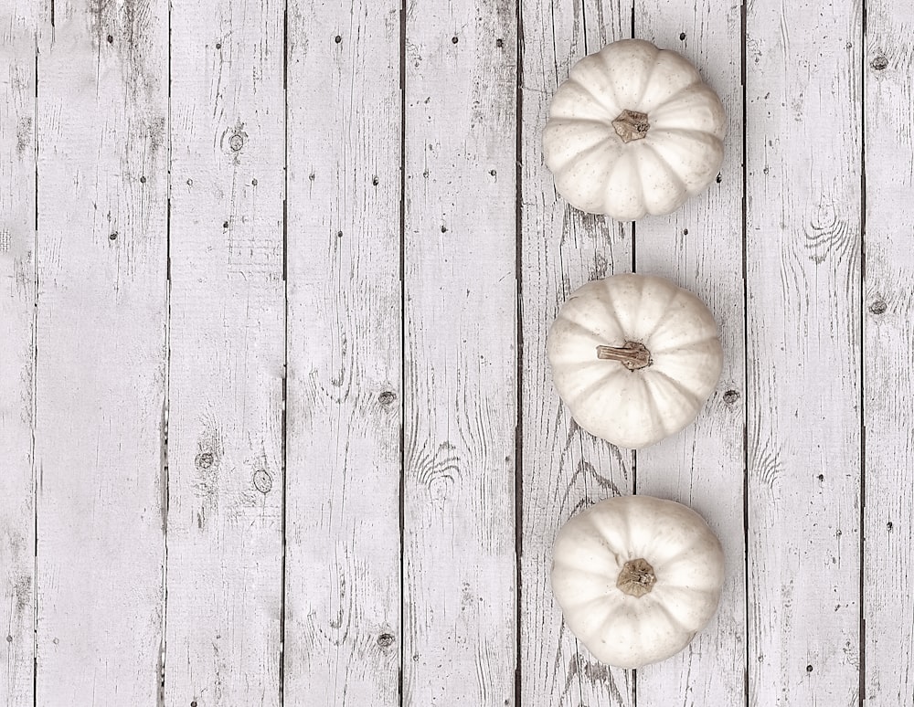 white garlic on gray wooden surface