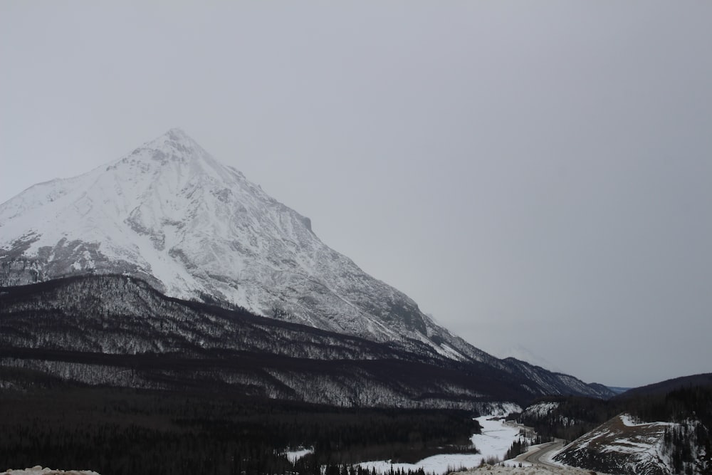 snow covered mountain during daytime