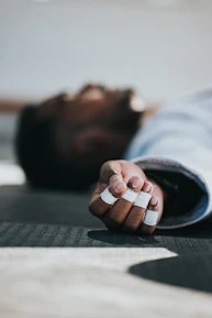 A close-up of hands demonstrating a functional movement stretch on a patient.