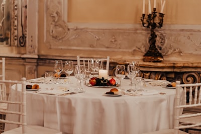 white table cloth with plates and glasses fancy google meet background