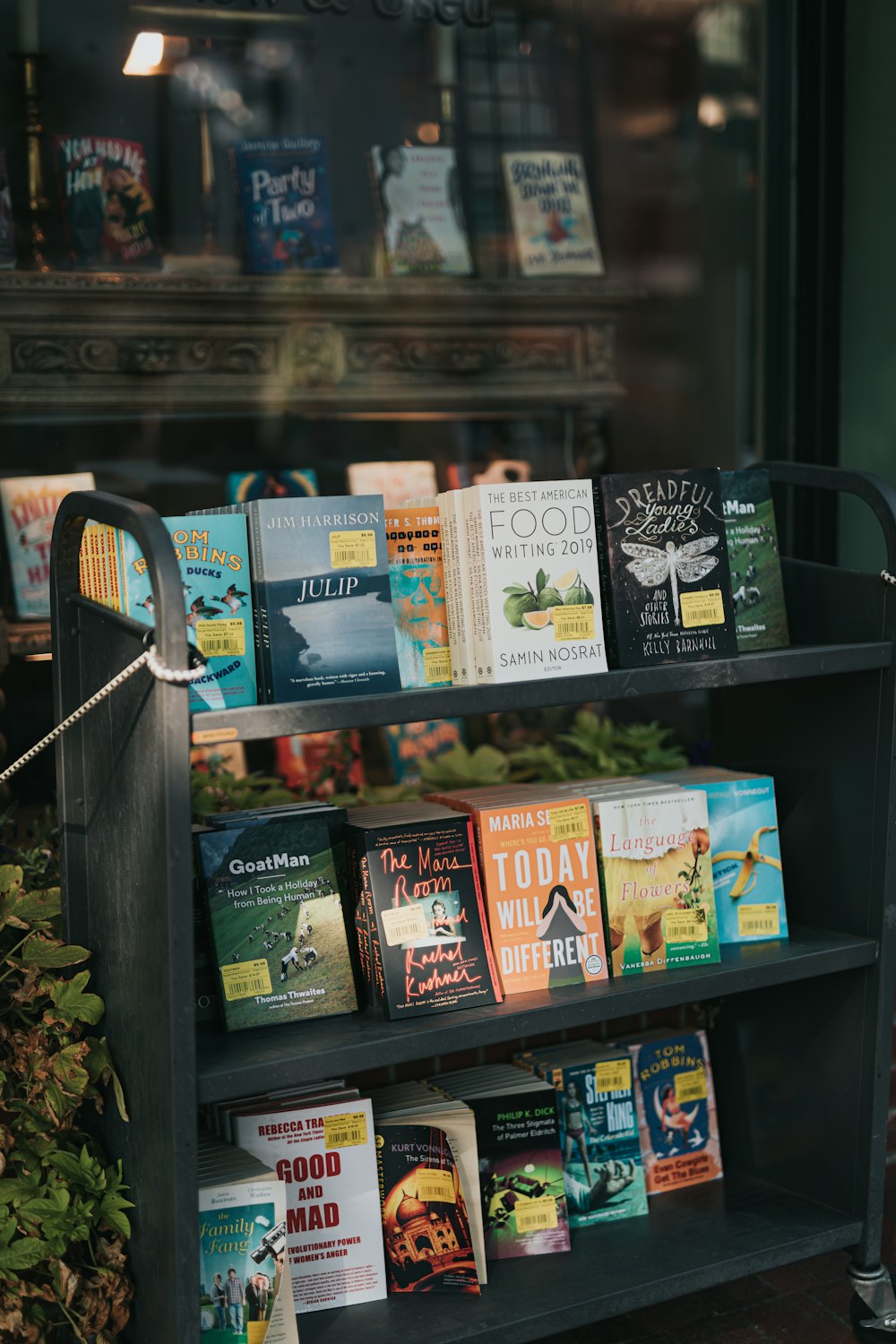 black wooden shelf with books