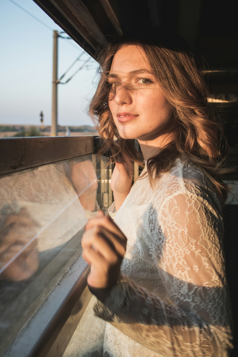 a woman looking out of a train window