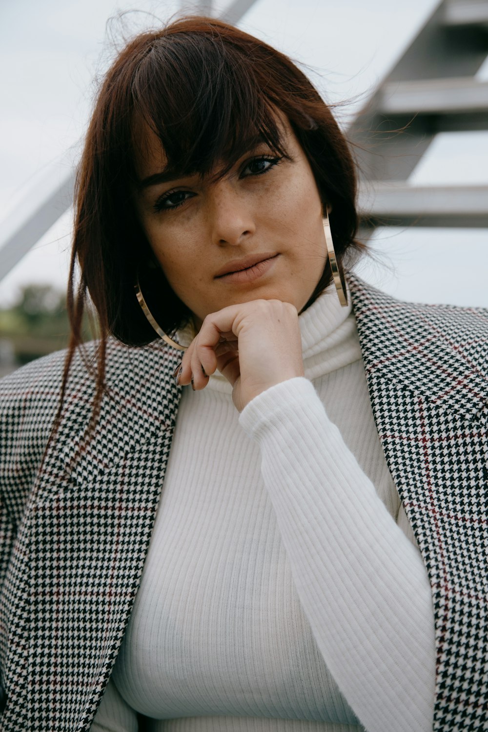 woman in white and black checkered long sleeve shirt