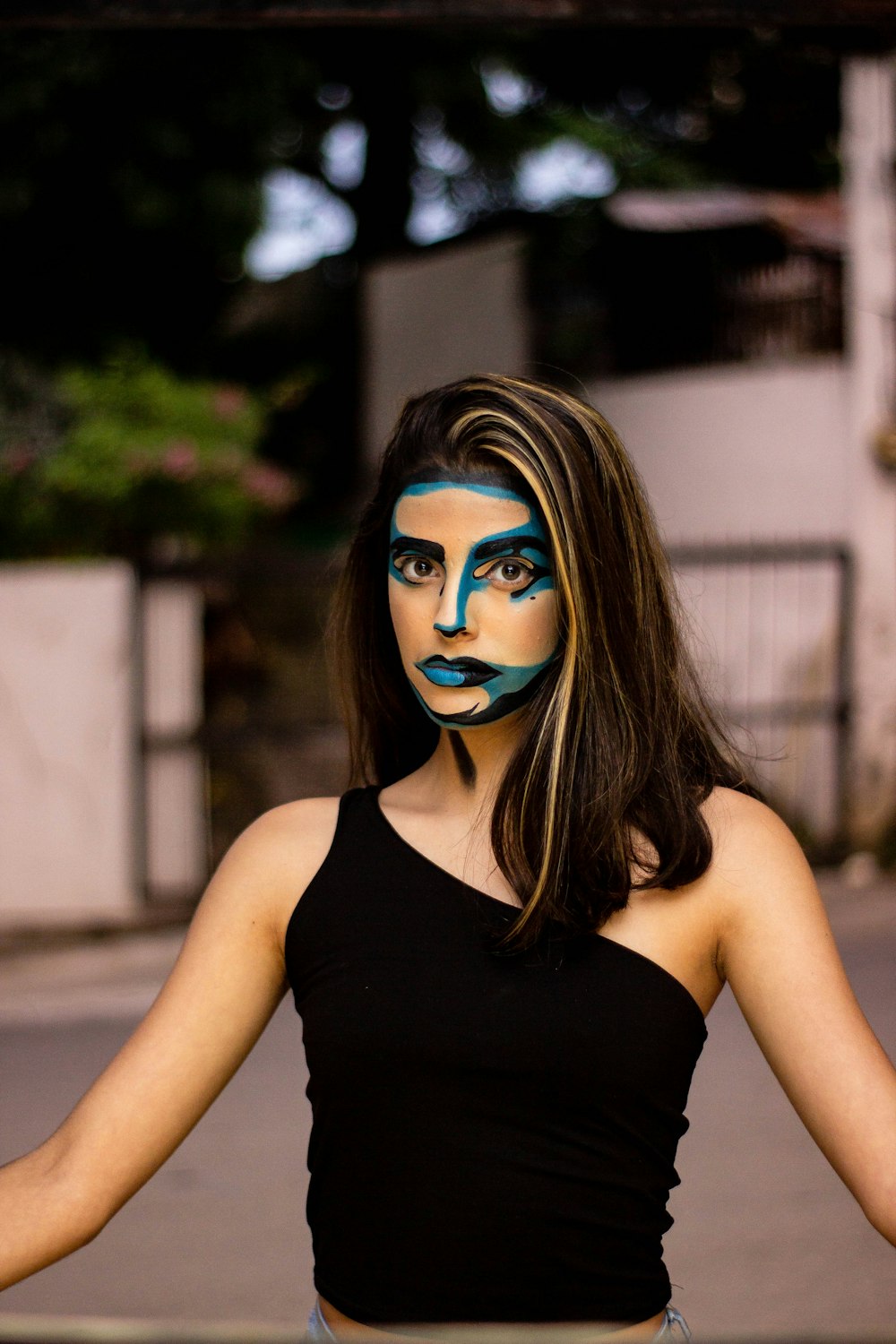 woman in black tank top with blue eyes