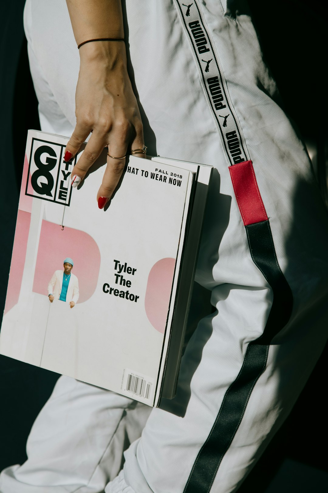 person holding white and red box