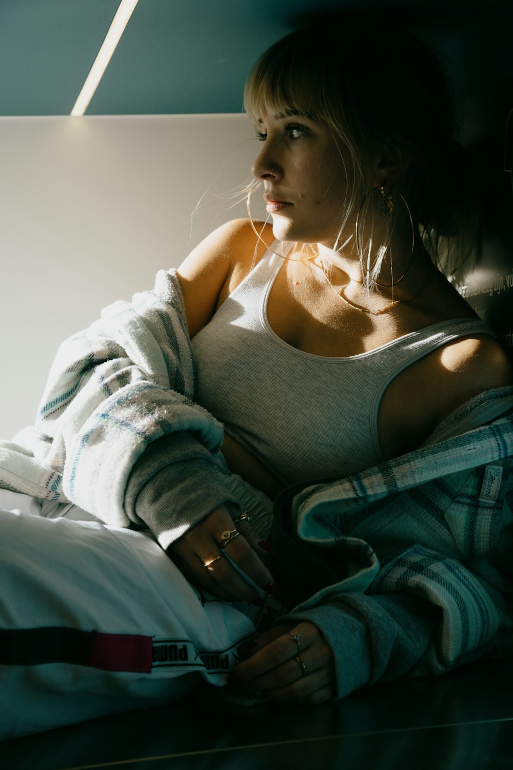 woman in black tank top and blue denim jeans