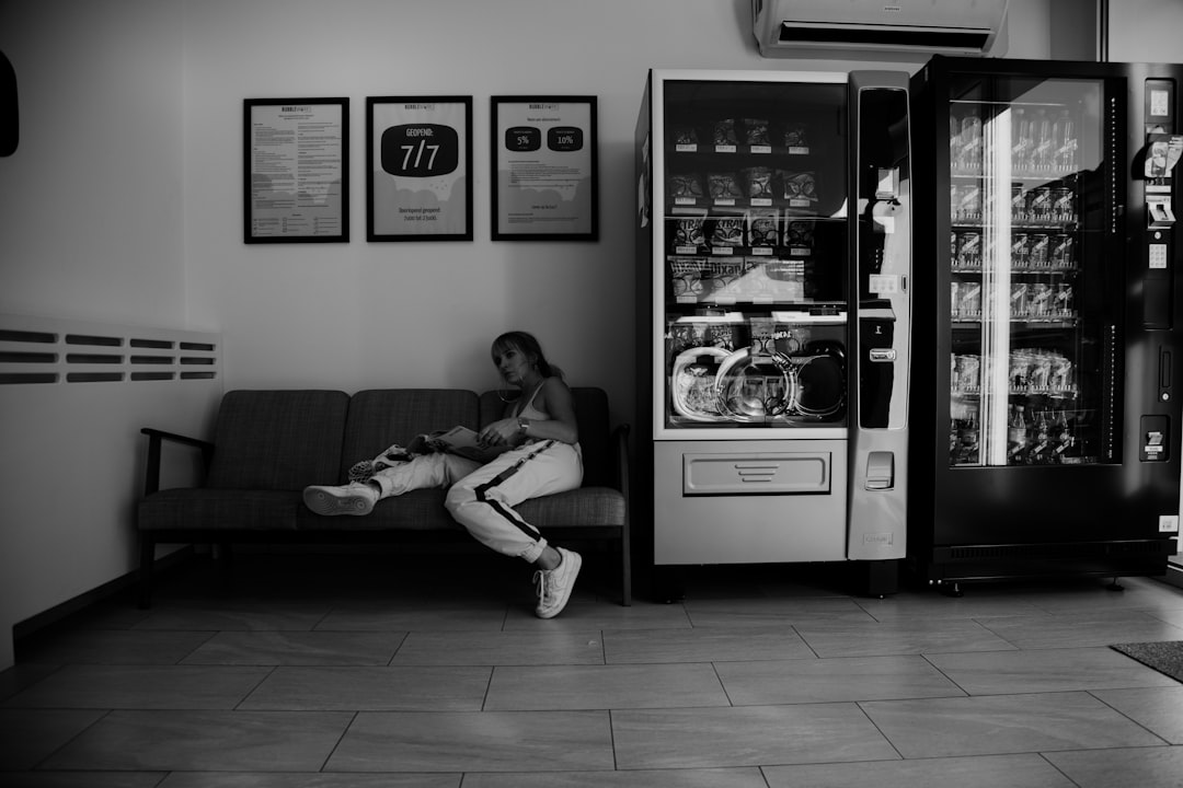 man and woman sitting on couch