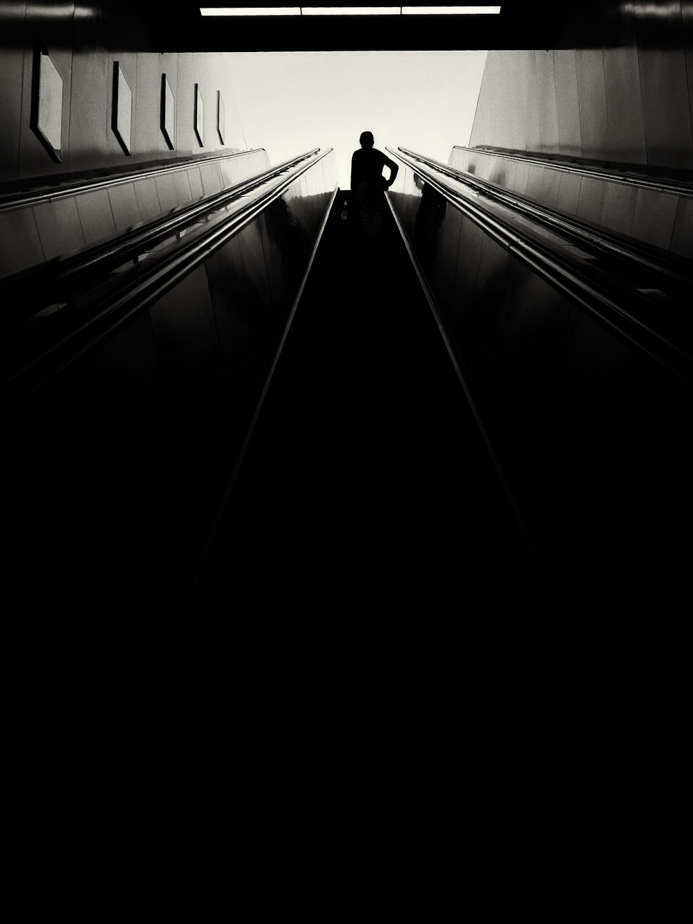 grayscale photo of a train station