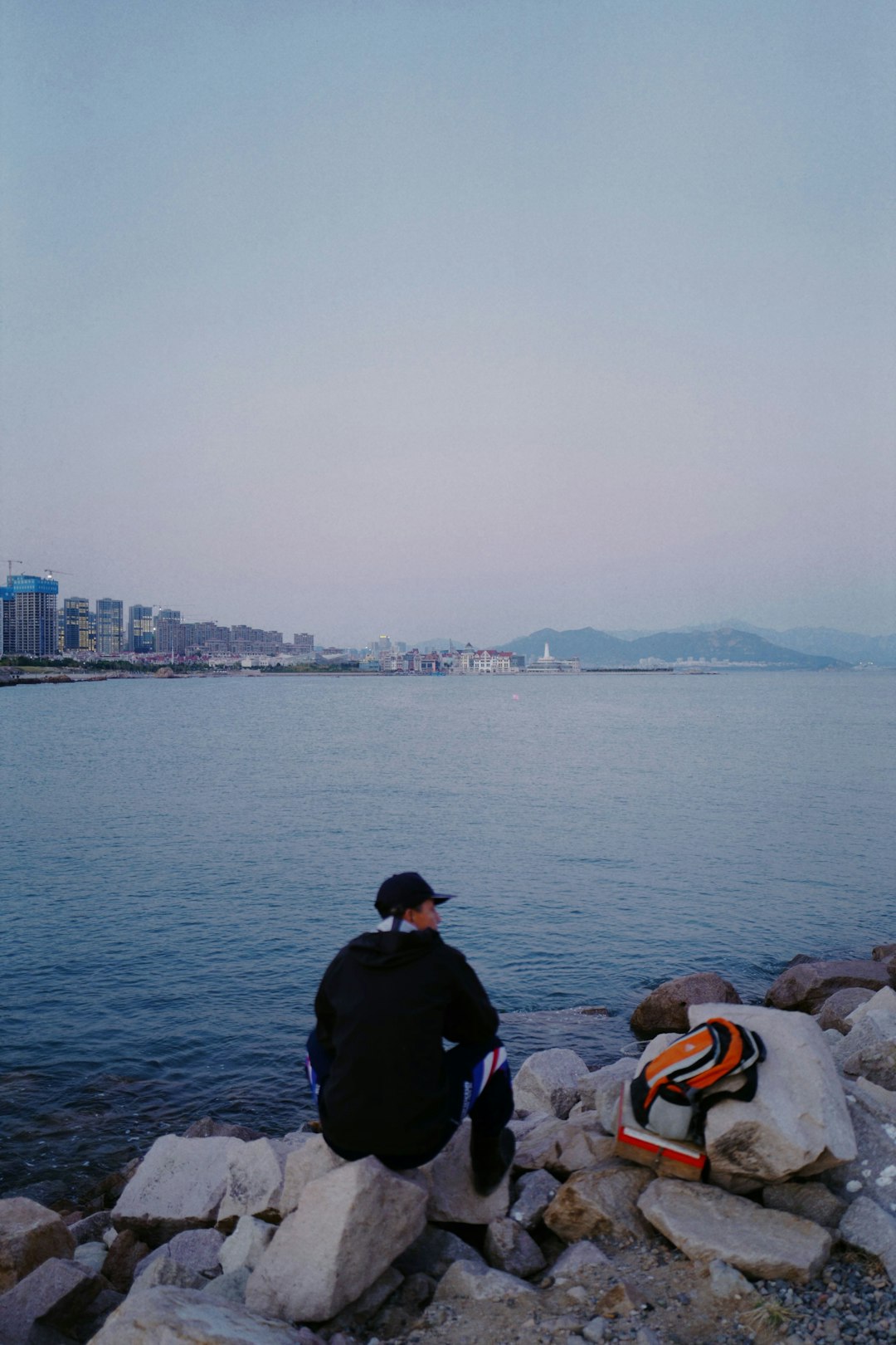 man in black jacket sitting beside man in black jacket