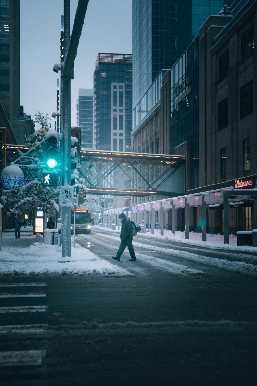 A skyway over a snowy downtown street