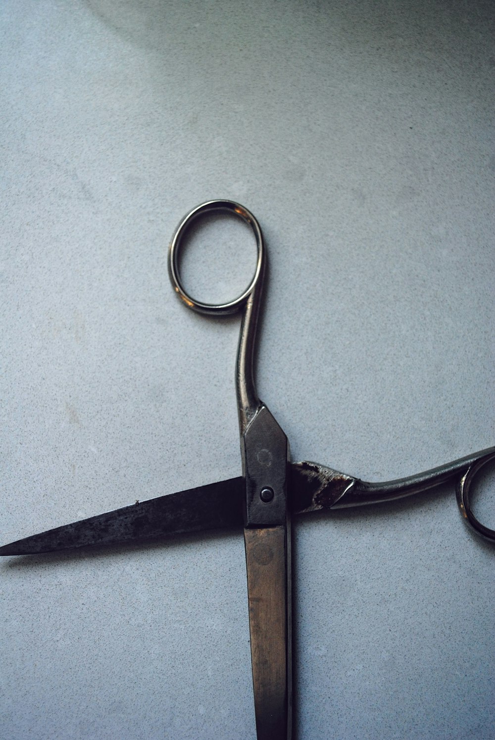 silver scissors on white table