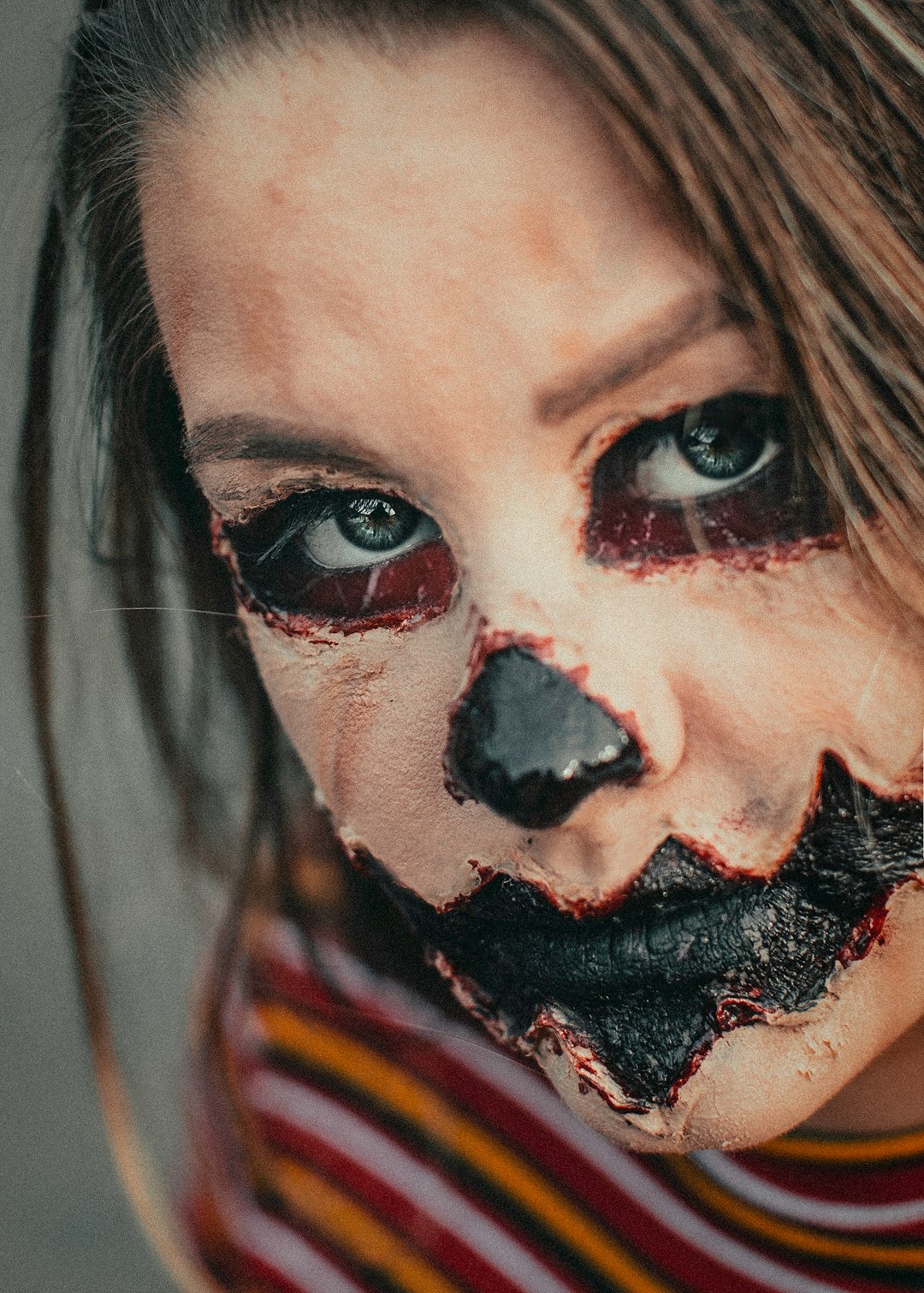 woman with black and red face paint