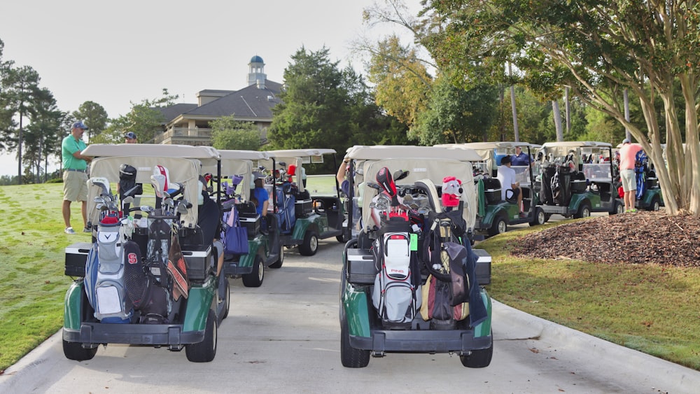 people riding on blue and white golf cart during daytime