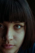 woman with silver stud earring