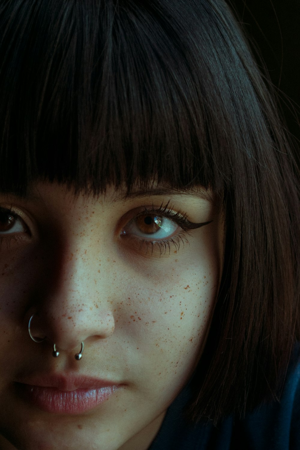 woman with silver stud earring