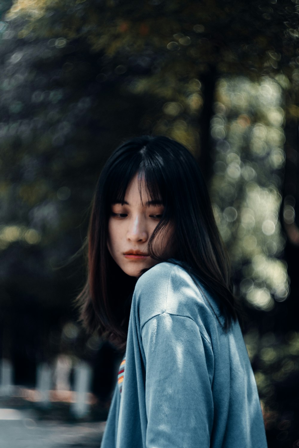 woman in blue long sleeve shirt