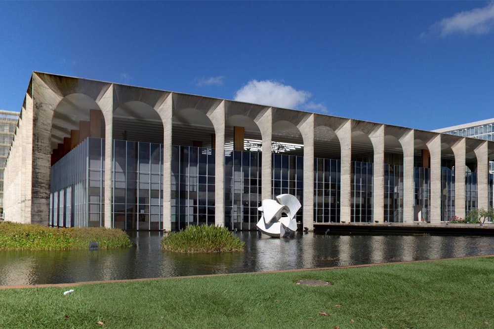 brown concrete building near green grass field during daytime