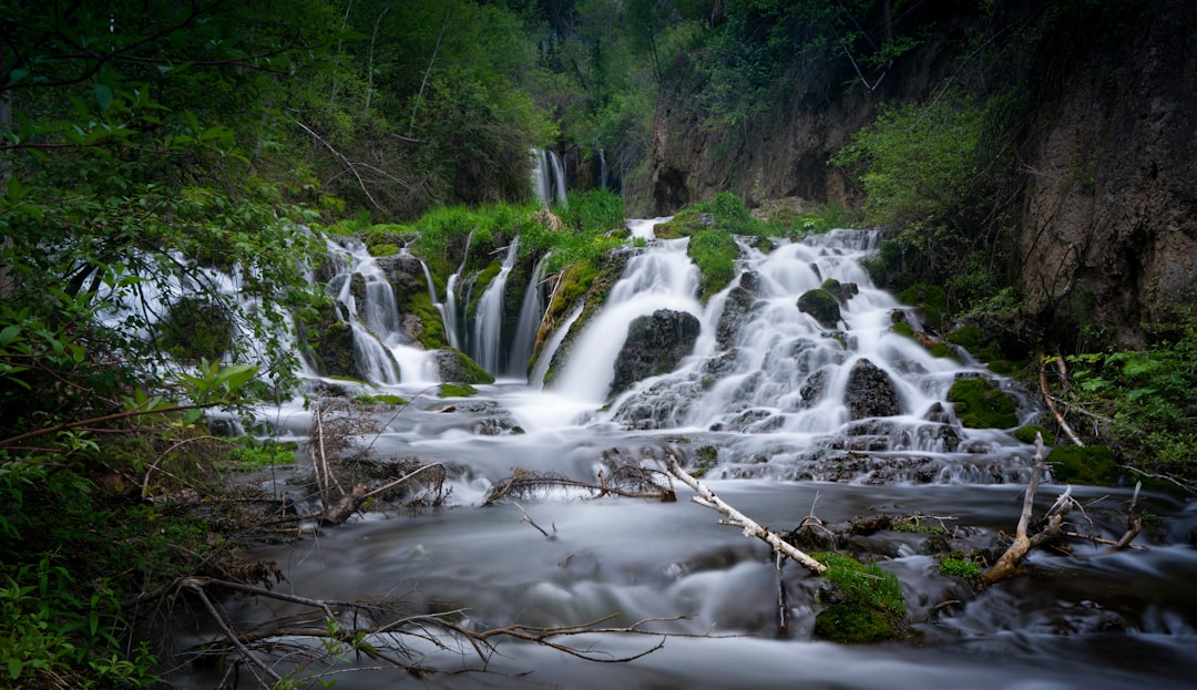 water falls on brown rocky ground