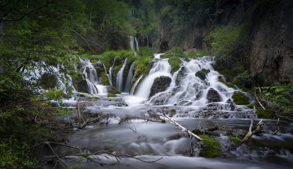 water falls on brown rocky ground