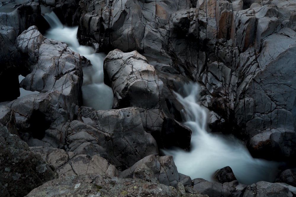 water falls on rocky mountain